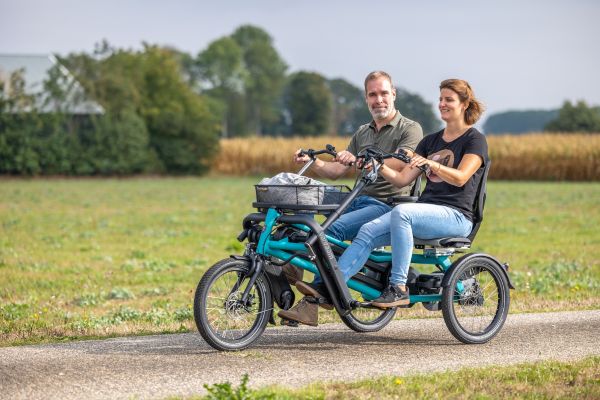 Side by side companion cycle cycling together with disabled people Van Raam