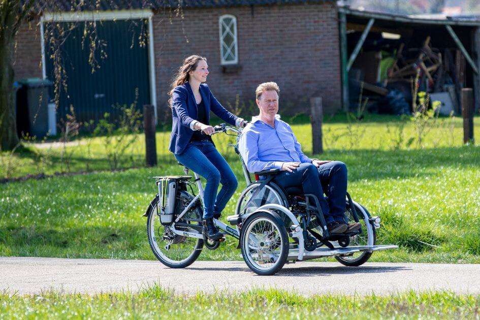 Bicycle with 2 wheels in front VeloPlus wheelchairbike Van Raam